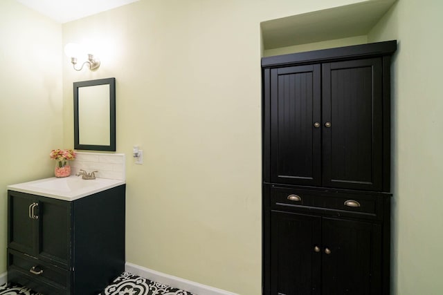 405 Houston St, Sulphur Springs, TX 75482 - bathroom featuring baseboards and vanity