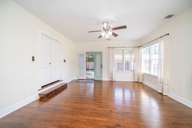 405 Houston St, Sulphur Springs, TX 75482 - unfurnished living room with wood finished floors, healthy amount of natural light, ceiling fan, ornamental molding, and baseboards