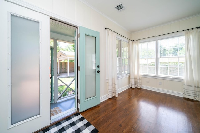 405 Houston St, Sulphur Springs, TX 75482 - doorway to outside with ornamental molding, dark wood-style flooring, and baseboards