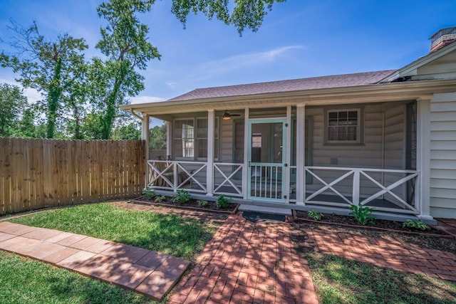 405 Houston St, Sulphur Springs, TX 75482 - view of front facade featuring a sunroom and a shingled roof
