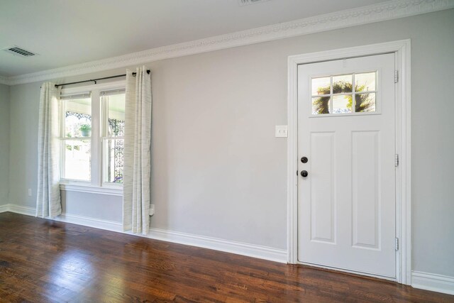 405 Houston St, Sulphur Springs, TX 75482 - foyer entrance featuring ornamental molding, wood finished floors, and baseboards