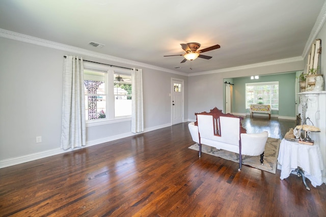 405 Houston St, Sulphur Springs, TX 75482 - living room featuring wood finished floors, a ceiling fan, baseboards, and crown molding