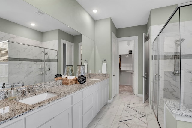 4860 Connor Pl, Fairview, TX 75069 - bathroom with a marble finish shower, marble finish flooring, double vanity, a spacious closet, and baseboards