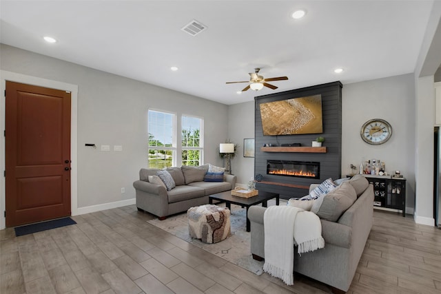 4860 Connor Pl, Fairview, TX 75069 - living room with a large fireplace, baseboards, a ceiling fan, recessed lighting, and light wood finished floors