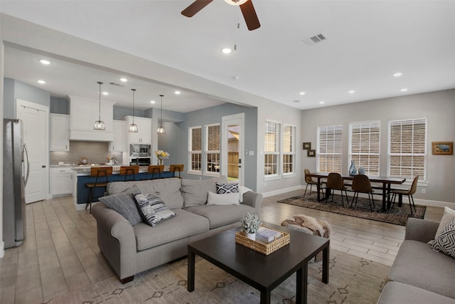 4860 Connor Pl, Fairview, TX 75069 - living area with light wood-style flooring, a ceiling fan, recessed lighting, and baseboards