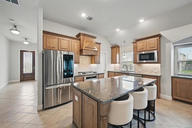 801 Dove Haven Ln, Melissa, TX 75454 - kitchen with appliances with stainless steel finishes, custom exhaust hood, a sink, a kitchen island, and backsplash