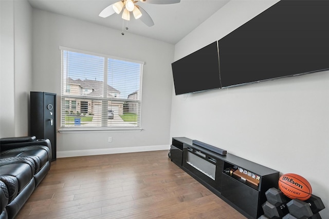 801 Dove Haven Ln, Melissa, TX 75454 - living area featuring ceiling fan, wood finished floors, and baseboards