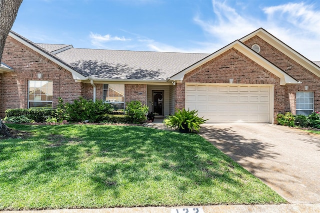 1202 Rice Rd Unit 122, Tyler, TX 75703 - view of front of house featuring brick siding, an attached garage, a front yard, and concrete driveway