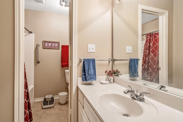 1202 Rice Rd Unit 122, Tyler, TX 75703 - bathroom featuring toilet, vanity, shower / bathtub combination with curtain, and baseboards
