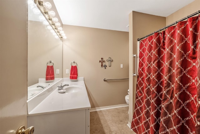 1202 Rice Rd Unit 122, Tyler, TX 75703 - bathroom with vanity, toilet, baseboards, and a shower with curtain