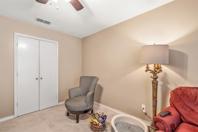 1202 Rice Rd Unit 122, Tyler, TX 75703 - living area with ceiling fan, carpet flooring, and baseboards