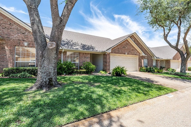 1202 Rice Rd Unit 122, Tyler, TX 75703 - view of front facade with brick siding, a garage, a front yard, and a shingled roof