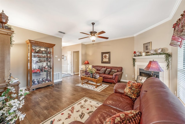 1202 Rice Rd Unit 122, Tyler, TX 75703 - living room with a ceiling fan, wood-type flooring, ornamental molding, baseboards, and a fireplace