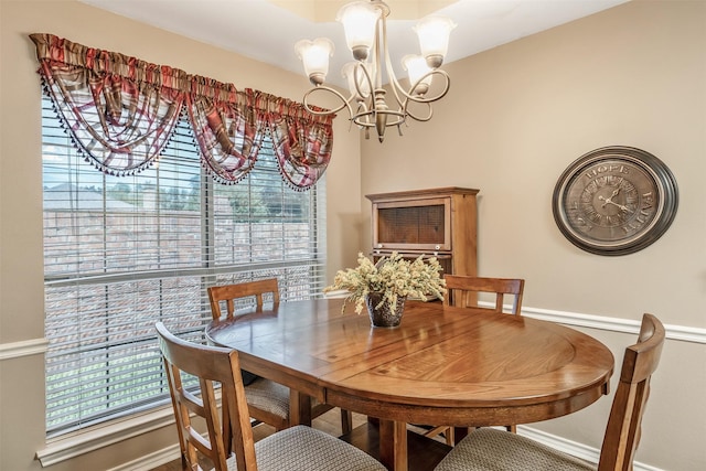 1202 Rice Rd Unit 122, Tyler, TX 75703 - dining space with a chandelier, healthy amount of natural light, and baseboards