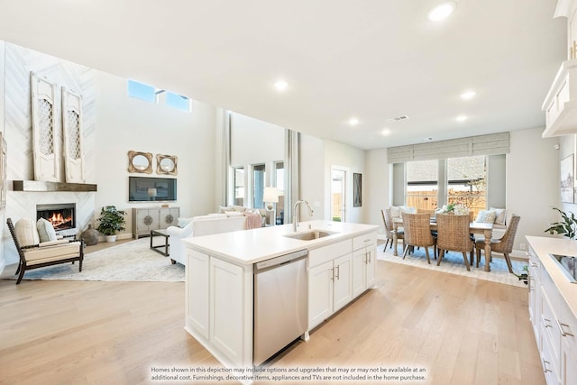 4410 Biscayne Dr, Midlothian, TX 76065 - kitchen featuring dishwasher, a sink, light wood finished floors, white cabinets, and recessed lighting