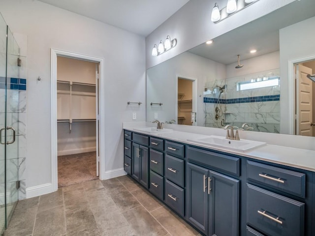 1110 Howley Ct, Forney, TX 75126 - bathroom featuring a spacious closet, a stall shower, double vanity, and baseboards