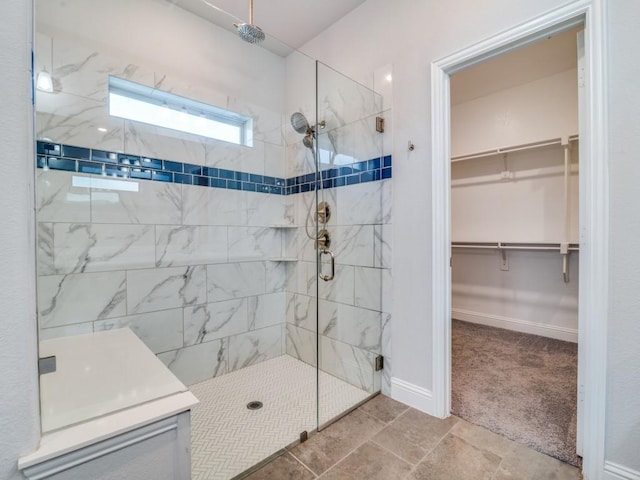 1110 Howley Ct, Forney, TX 75126 - full bath featuring a shower stall, a walk in closet, and baseboards