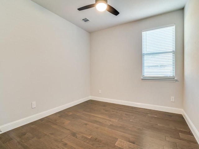 1110 Howley Ct, Forney, TX 75126 - spare room with ceiling fan, dark wood-style flooring, and baseboards