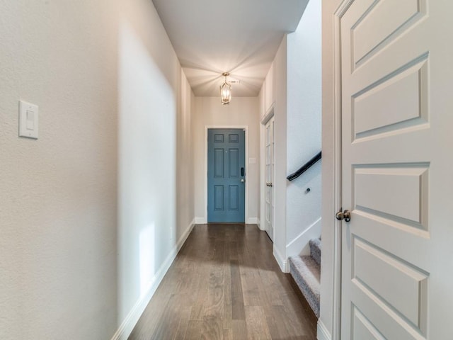 1110 Howley Ct, Forney, TX 75126 - corridor with dark wood-type flooring, baseboards, and a chandelier