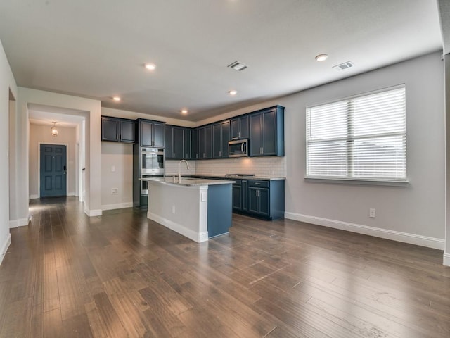 1110 Howley Ct, Forney, TX 75126 - kitchen featuring appliances with stainless steel finishes, baseboards, tasteful backsplash, light countertops, and recessed lighting