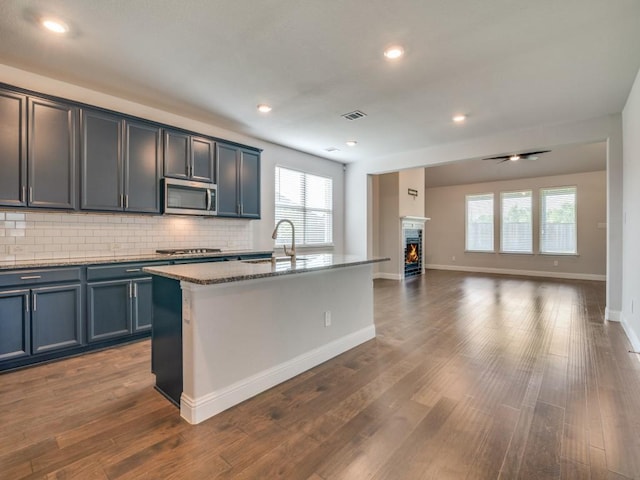 1110 Howley Ct, Forney, TX 75126 - kitchen with appliances with stainless steel finishes, a sink, healthy amount of natural light, decorative backsplash, and recessed lighting