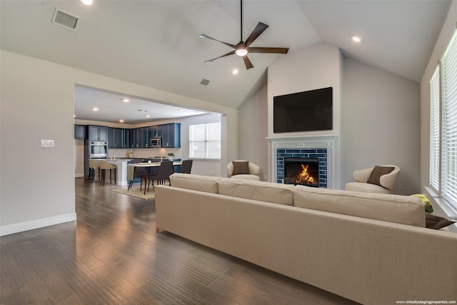 1110 Howley Ct, Forney, TX 75126 - living room with ceiling fan, dark wood-style floors, a fireplace, high vaulted ceiling, and recessed lighting