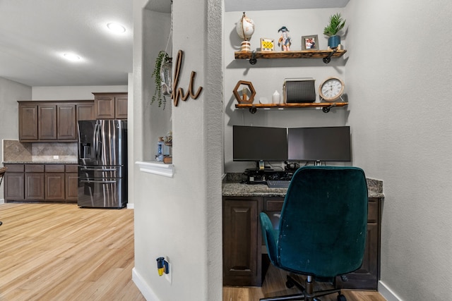 15712 Oak Pointe Dr, Fort Worth, TX 76177 - home office featuring light wood-style floors, baseboards, and a textured wall