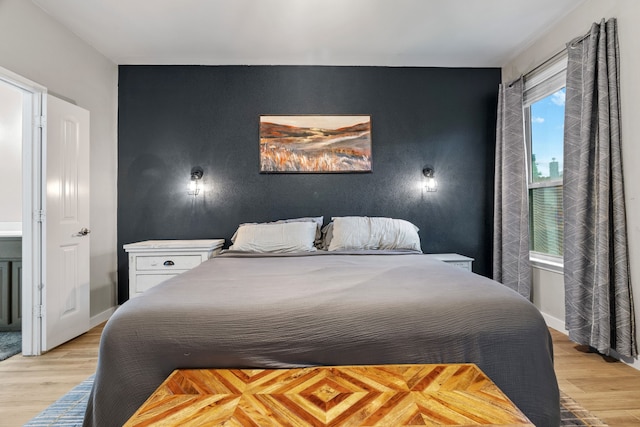 15712 Oak Pointe Dr, Fort Worth, TX 76177 - bedroom featuring an accent wall and light wood finished floors