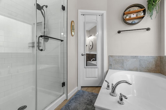 15712 Oak Pointe Dr, Fort Worth, TX 76177 - bathroom with a stall shower, a bath, and wood finished floors