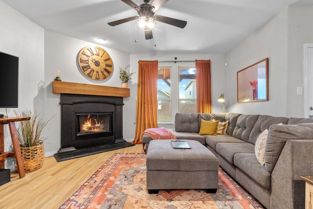 15712 Oak Pointe Dr, Fort Worth, TX 76177 - living room with a warm lit fireplace, wood finished floors, and a ceiling fan