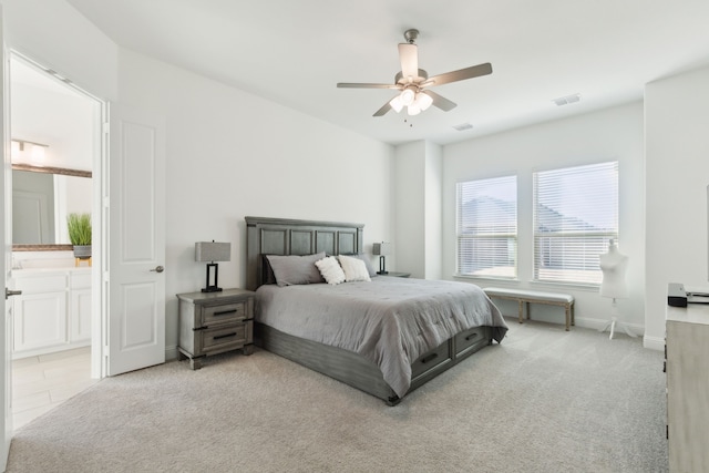 232 Lakewood Ln, Ponder, TX 76259 - bedroom with light colored carpet, ceiling fan, and ensuite bathroom