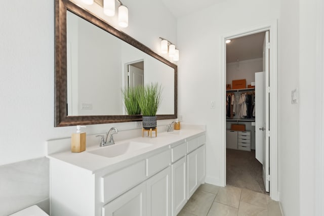 232 Lakewood Ln, Ponder, TX 76259 - full bath with double vanity, a walk in closet, and tile patterned floors