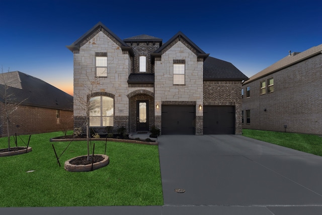 232 Lakewood Ln, Ponder, TX 76259 - french country home featuring driveway, stone siding, brick siding, an attached garage, and a lawn