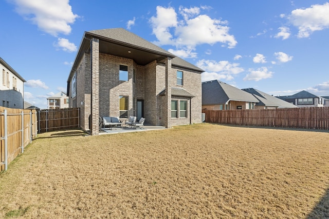 232 Lakewood Ln, Ponder, TX 76259 - rear view of house featuring brick siding, a patio area, a fenced backyard, and a residential view