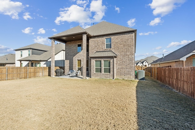 232 Lakewood Ln, Ponder, TX 76259 - back of property with brick siding, a patio, a fenced backyard, a residential view, and roof with shingles