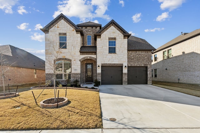 232 Lakewood Ln, Ponder, TX 76259 - french country style house featuring stone siding, driveway, a garage, brick siding, and roof with shingles
