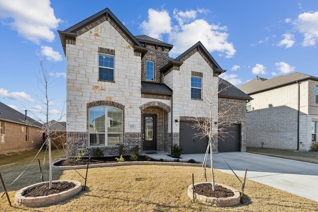 232 Lakewood Ln, Ponder, TX 76259 - french provincial home featuring driveway, roof with shingles, stone siding, and an attached garage