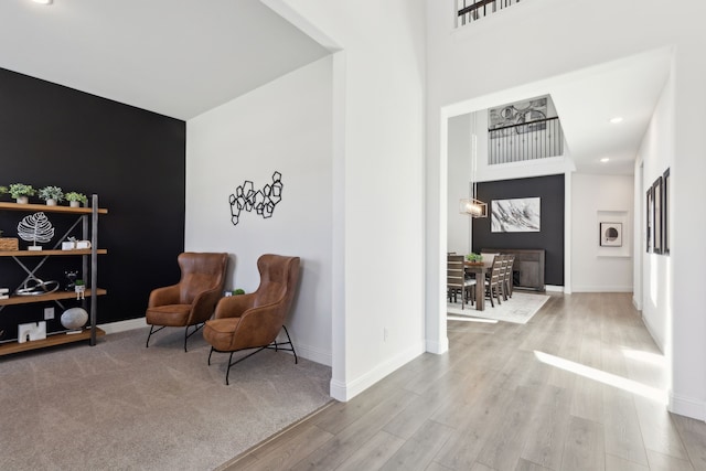 232 Lakewood Ln, Ponder, TX 76259 - sitting room featuring wood finished floors, recessed lighting, and a towering ceiling