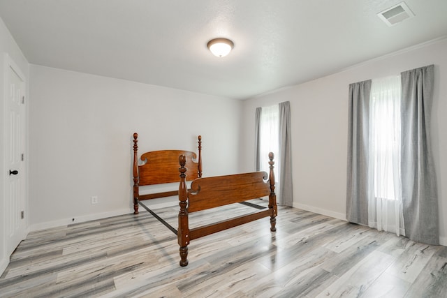 853 County Road 2215, Decatur, TX 76234 - bedroom with light wood-style floors and baseboards