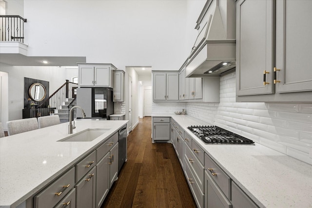 2012 Grover Ln, Rockwall, TX 75087 - kitchen featuring gray cabinets, custom range hood, a sink, stainless steel appliances, and dark wood-style floors