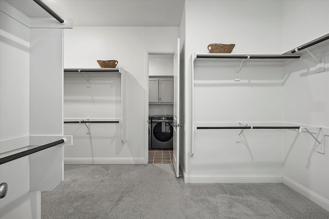 2012 Grover Ln, Rockwall, TX 75087 - walk in closet featuring washer / dryer and carpet flooring