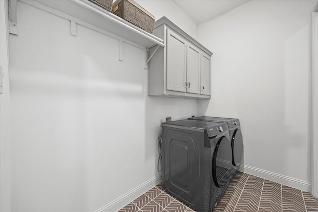 2012 Grover Ln, Rockwall, TX 75087 - laundry room with washer and dryer, cabinet space, and baseboards