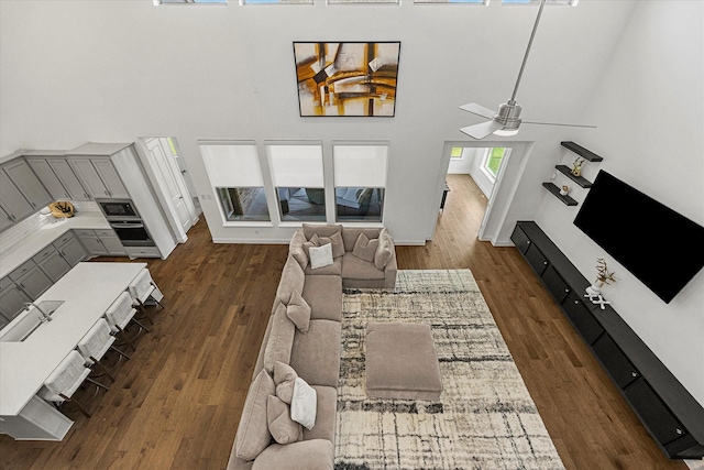 2012 Grover Ln, Rockwall, TX 75087 - living room with a towering ceiling, dark wood-style flooring, and a ceiling fan