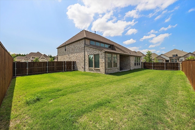 2012 Grover Ln, Rockwall, TX 75087 - rear view of property featuring brick siding