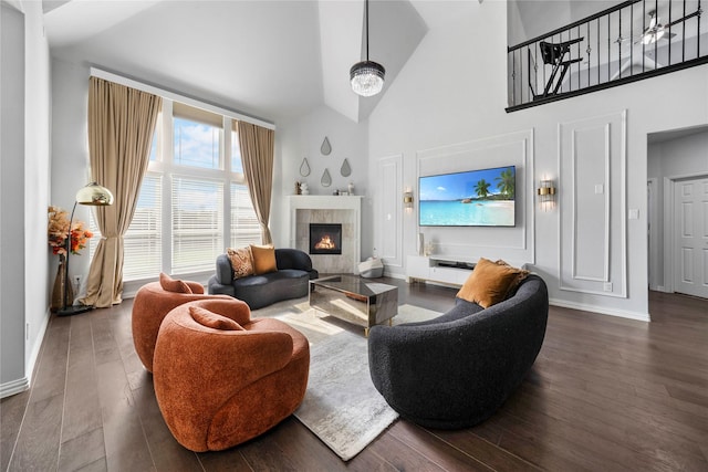 1708 Ordonez Dr, Little Elm, TX 75068 - living room featuring high vaulted ceiling, a fireplace, baseboards, and wood finished floors
