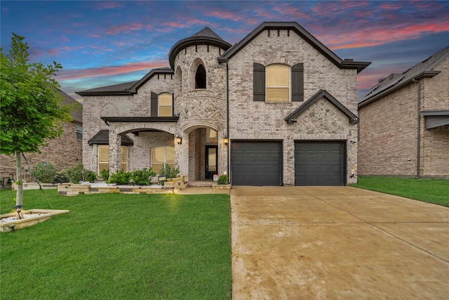 1708 Ordonez Dr, Little Elm, TX 75068 - french country home with a lawn, an attached garage, brick siding, and concrete driveway