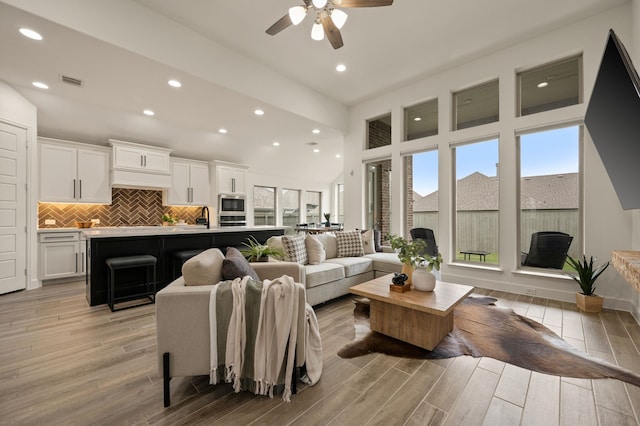 2232 Autrey Ln, Northlake, TX 76247 - living area with recessed lighting, a ceiling fan, light wood-type flooring, and a towering ceiling