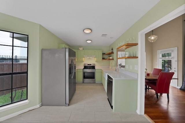 4301 Jenning Ct, Plano, TX 75093 - kitchen featuring stainless steel appliances, green cabinetry, light countertops, open shelves, and healthy amount of natural light