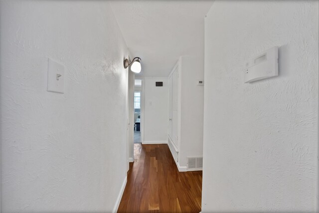 4301 Jenning Ct, Plano, TX 75093 - hall featuring dark wood-type flooring and baseboards