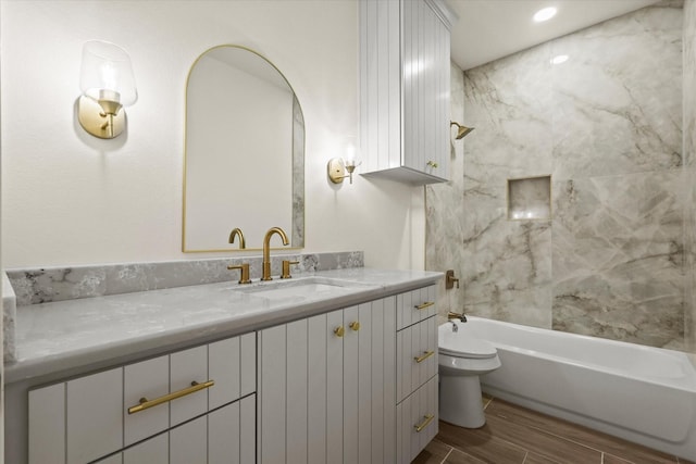 609 N Stewart St, Azle, TX 76020 - full bathroom with toilet, vanity, shower / washtub combination, and wood tiled floors